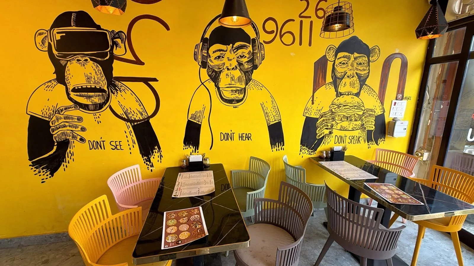 The Buns & Chaap yellow wall dining area
