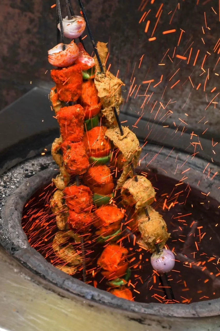 Tandoori chaap cooking over charcoal
